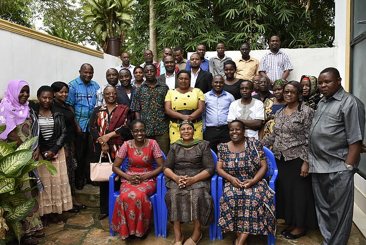 Group photo of the workshop participant, from Left Sitting Project Officer Hanns Seidel Foundation Ms. Kadele Mabumba, Handeni District Commissioner Ms. Husna Msangi. and Handeni Acting Director Ms. Zawadi Ngendo